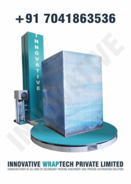 Automatic stretch wrapping machine wrapping industrial pallet load with protective film